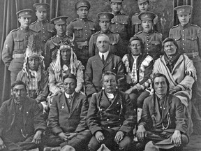 Elders and Native soldiers in the uniform of the Canadian Expeditionary Force, ca. 1916-17. Credit: Library and Archives Canada.