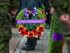 File photos of Remembrance Day at the Chinatown Memorial Plaza in Vancouver, B.C.