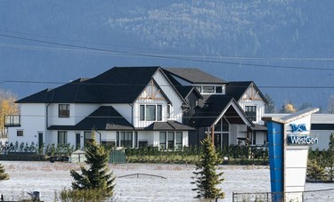 A home is surrounded by flood waters in Abbotsford, BC, November, 17, 2021.