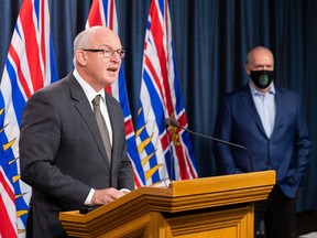 Minister of Public Safety Mike Farnworth (left) and Premier John Horgan provide updates on recovery efforts following recent flooding and landslides during a public briefing on Thursday.