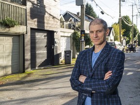 Dr. Thomas Davidoff poses for a photo in a back lane in Vancouver, B.C., November, 21, 2021. Dr. Davidoff authored a new study that shows laneway homes reduce value of west side properties.