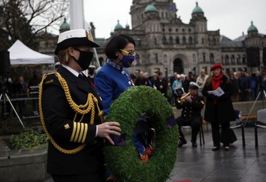 Lt.- Gov. Janet Austin lays a wreath in honour of those lost in the war as she takes part in a Remembrance Day service at the cenotaph on the grounds of the legislature in Victoria, B.C., on Thursday, Nov. 11, 2021.