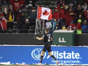 Canadian defender Alistair Johnston acknowledges the 40,000-plus fans who packed Edmonton's Commonwealth Stadium on Tuesday to celebrate Canada's 2-1 win over Mexico in CONCACAF men's World Cup qualifying play.