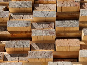 Cut lengths of timber planks stacked at a lumber yard. Photographer: Andrey Rudakov/Bloomberg ORG XMIT: 128