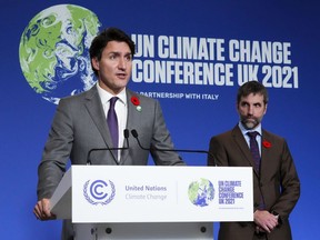 Prime Minister Justin Trudeau and Minister of Environment and Climate Change Steven Guilbeault at a Nov. 2 news conference at COP26 in Glasgow, Scotland.