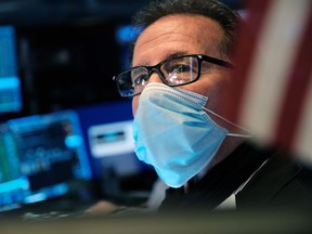 A trader works on the floor of the New York Stock Exchange.