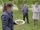 Camosun College archaeologist and anthropology professor Nicole Kilburn serves a plate of bugs (yum!) to Adrian Maddaloni and Jaymie Chudiak (right), as part of the Curb Your Carbon episode of Nature of Things , which airs January 14 at 9 p.m. on CBC and CBC Gem, and will be hosted by actor Ryan Reynolds.