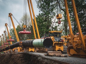 Laying pipe for the Trans Mountain expansion project near Popukum in the Fraser Valley in May 2021.
