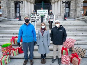 Conservation groups stand outside the B.C. legislature Dec. 21 calling for the province to put up more money in support of old-growth forest protection. From left, in front: Andy MacKinnon, forest ecologist and Metchosin councillor; Andrea Inness, campaigner, Ancient Forest Alliance; and Adam Olsen, Green party MLA for Saanich North and the Islands.