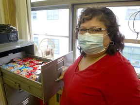 Bonnie Wendt, an Indigenous enhancement worker at Killarney Secondary in Vancouver, with a filing cabinet drawer filled with soup and noodles for students to eat.