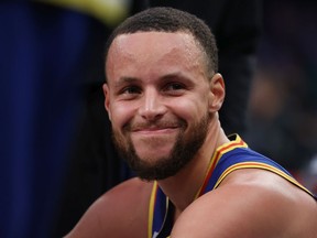 Stephen Curry of the Golden State Warriors looks on after making a three point basket to break Ray Allen's record for the most all-time against the New York Knicks during their game at Madison Square Garden on Dec. 14, 2021 in New York City.