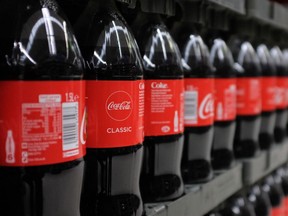 Bottles of Coca-Cola are pictured at a branch of Asda in north London, on April 27, 2018. - 42 firms, responsible for 80 percent of plastic packaging sold in Britain, have signed up to a pact that aims to tackle plastic pollution over the next seven years through a series of measures. (Photo by Daniel LEAL / AFP) (Photo by DANIEL LEAL/AFP via Getty Images)