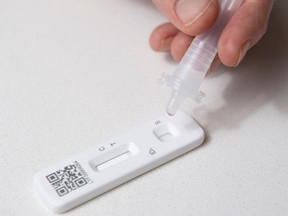 Rapid tests for COVID-19, like this one in Britain, are hard to get in B.C. but can be purchased online.