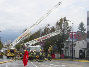 Firefighters battled a blaze overnight and into the morning on Oct. 15, 2020 after fire hit a row of businesses in the 4000-block of Cambie Street in Vancouver. Credit: Mike Bell/PNG [PNG Merlin Archive]