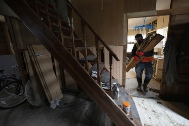 CP-Web. A man helps clear out the contents of a house that was flooded in downtown Princeton, B.C., Friday, Dec. 3, 2021. Princeton, like many parts of the province, was hit with heavy floods and mudslides over the past couple of weeks causing major devastation.
