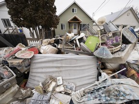 The insides of homes that were flooded are pictured on the street in downtown Princeton, B.C., Friday, Dec. 3, 2021.
