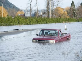 Abbotsford, BC: DECEMBER 03, 2021 -- Water is slowly receding from flood devastated Sumas prairie in Abbotsford, BC Friday, December 3, 2021. A submerged truck in the ditch of the Trans-Canada Highway in Abbotsford Friday. 



(Photo by Jason Payne/ PNG)

(For story by reporter) ORG XMIT: borderflood [PNG Merlin Archive]