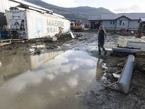 Sumas prairie residents begin the slow process of repairing the damage caused by earlier flooding. One concern has been incidents of theft on the prairie. Pictured is Kelsey Mostertman.