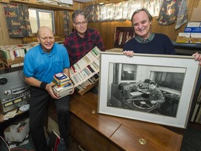 Gary Spence (left), Bob Nixon and Colin Preston with a collection of CBC audio tapes that Spence's late father Alf Spence, who worked for CBC radio, rescued from destruction many years ago. Preston holds a picture of Alf Spence.