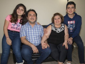 Maan Dabbagh came from Syria in 2018 with his wife, Marwah (Mary), daughter Merna, 11, and son Shareef, 13. The family are shown here at their Coquitlam home on Friday, Dec. 10, 2021.