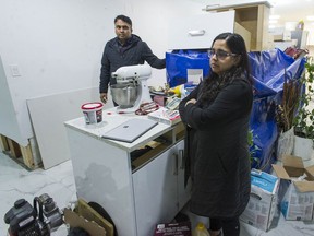 Imran Akhtar and his wife, Hazra Imran, at their home in Richmond, where the main floor is being repaired after being flooded with sewage.