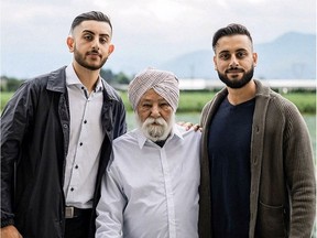 Gagan Khakh, left, with his grandfather and cousin. The family was evacuated when their farm flooded, destroying field crops and blueberry plants, but they plan to continue farming.