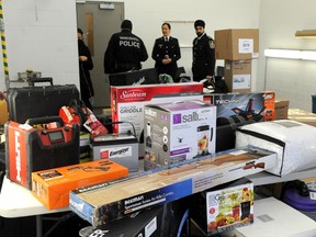 Vancouver police show off some of the proceeds of crime from a months-long undercover sting into criminal groups trafficking in stolen goods in the Downtown Eastside on Monday.