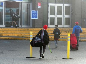 Hockey players show vaccination status at Scotia Barn in Burnaby on Sunday as hockey tournaments and other events were cancelled or scaled back until Jan. 31 under new COVID-19 restrictions in B.C.