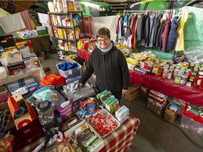 Alison Arends with donated food and provisions for people who have been hard hit by flooding and cold weather.