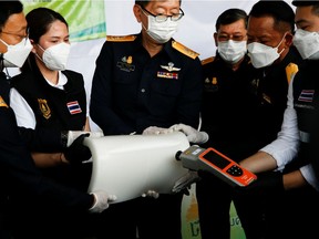 Thai authorities show the result of machine test as they seized 897 kilograms of crystal methamphetamine.