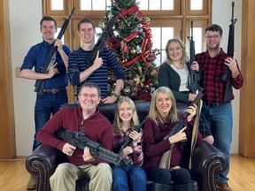 U.S. Rep. Thomas Massie (R-Ky.) in a Christmas photo of his family holding guns, in this image obtained from Twitter, posted on Dec. 4, 2021.