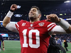 Jimmy Garoppolo of the San Francisco 49ers walks off the field after beating the Dallas Cowboys 23-17 in the NFC Wild Card game at AT&T Stadium on Jan. 16 in Arlington, Tex.