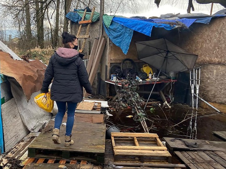  Street Thug Barbers volunteer Jennifer delivers food and supplies to a homeless person in Abbotsford.