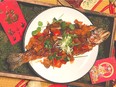 Crispy whole Fresh B.C. Rainbow Trout with Sweet and Sour Sauce.