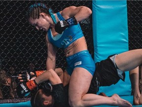 Alana Cook (top) of Maple Ridge won her first pro MMA event on Jan. 14 in Calgary, forcing Ottawa golden gloves boxer Maxime Turcotte-Novosedlik into submission in the first round at the Pallas Athena Women's Fighting Championships.