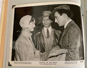 A promotional photo of Singin' in the Rain' featuring Debbie Reynolds, Donald O'Connor and Gene Kelly from the Joan Moore Collection.