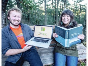 Aidan Pine, who developed a SEN&#262;O&#358;EN Wordle version, left, and PEPA&#7732;IYE with a SEN&#262;O&#358;EN dictionary, on Observatory Road in Saanich.