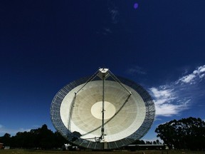 The Australian Commonwealth Scientific and Industrial Research Organisation's Australia Telescope National Facility Parkes Observatory radio telescope points to the sky in Parkes, Australia.