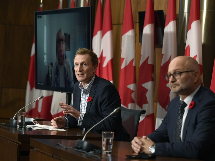  Marc Miller, minister of Crown-Indigenous Relations, centre, at a news conference about the order from the Canadian Human Rights Tribunal to compensate Indigenous children and their families, in Ottawa, on Oct. 29, 2021.