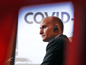 Health Minister Jean-Yves Duclos participates in a news conference on the COVID-19 pandemic and the omicron variant, in Ottawa, on Friday, Dec. 17, 2021.