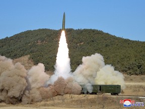 A railway-borne missile is launched during firing drills according to state media, at an undisclosed location in North Korea, in this photo released January 14, 2022 by North Korea's Korean Central News Agency (KCNA).
