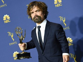 Peter Dinklage poses with his Emmy during the 70th Emmy Awards at the Microsoft Theatre in Los Angeles, California on September 17, 2018.