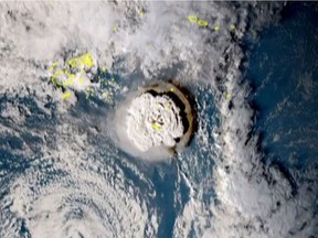 A grab taken from footage by Japan's Himawari-8 satellite and released by the National Institute of Information and Communications (Japan) on January 15, 2022 shows the volcanic eruption that provoked a tsunami in Tonga. - The eruption was so intense it was heard as "loud thunder sounds" in Fiji more than 800 kilometres (500 miles) away. AFP PHOTO / NATIONAL INSTITUTE OF INFORMATION AND COMMUNICATIONS (JAPAN) "
