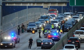 Vancouver police on scene as the environmental group Extinction Rebellion blocks southbound traffic on the Ironworkers Memorial Bridge in Vancouver Monday morning.