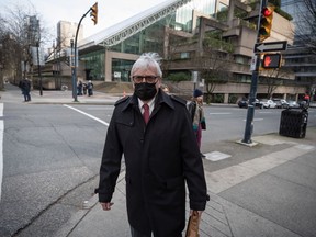 Craig James, former clerk of the British Columbia legislature, leaves B.C. Supreme Court during a break from his trial in Vancouver, on Wednesday, January 26, 2022.