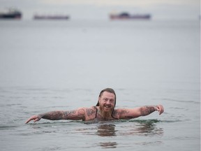 There was no formal polar bear swim for the second year in a row at English Bay to ring in the New Year, but several dozen hearty swimmers, including Graham Carr at Barge Chilling Beach, took to the water anyway on New Year's Day.
