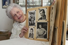 Joan Moore with more 1950s movie star promo photographs from her collection. Clockwise from left: Dean Martin and Jerry Lewis, Gig Young, Burt Lancaster and Fernando Lamas.