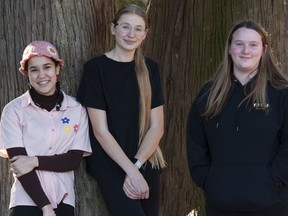 Abbotsford School of Integrated Arts students, from left, Nayimah Lewis, Lauren Palmer and Lauren Matties at their school on Jan. 27.