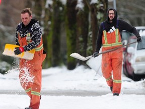 City workers sprinkle salt as Environment Canada has issued winter storm warnings for all of the Lower Mainland and beyond, as a low-pressure system will drop heavy snow across the south coast starting Wednesday evening.