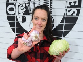 Ashley Sugar, marketing manager for Organic Acres on Main Street in Vancouver, with local produce in season.